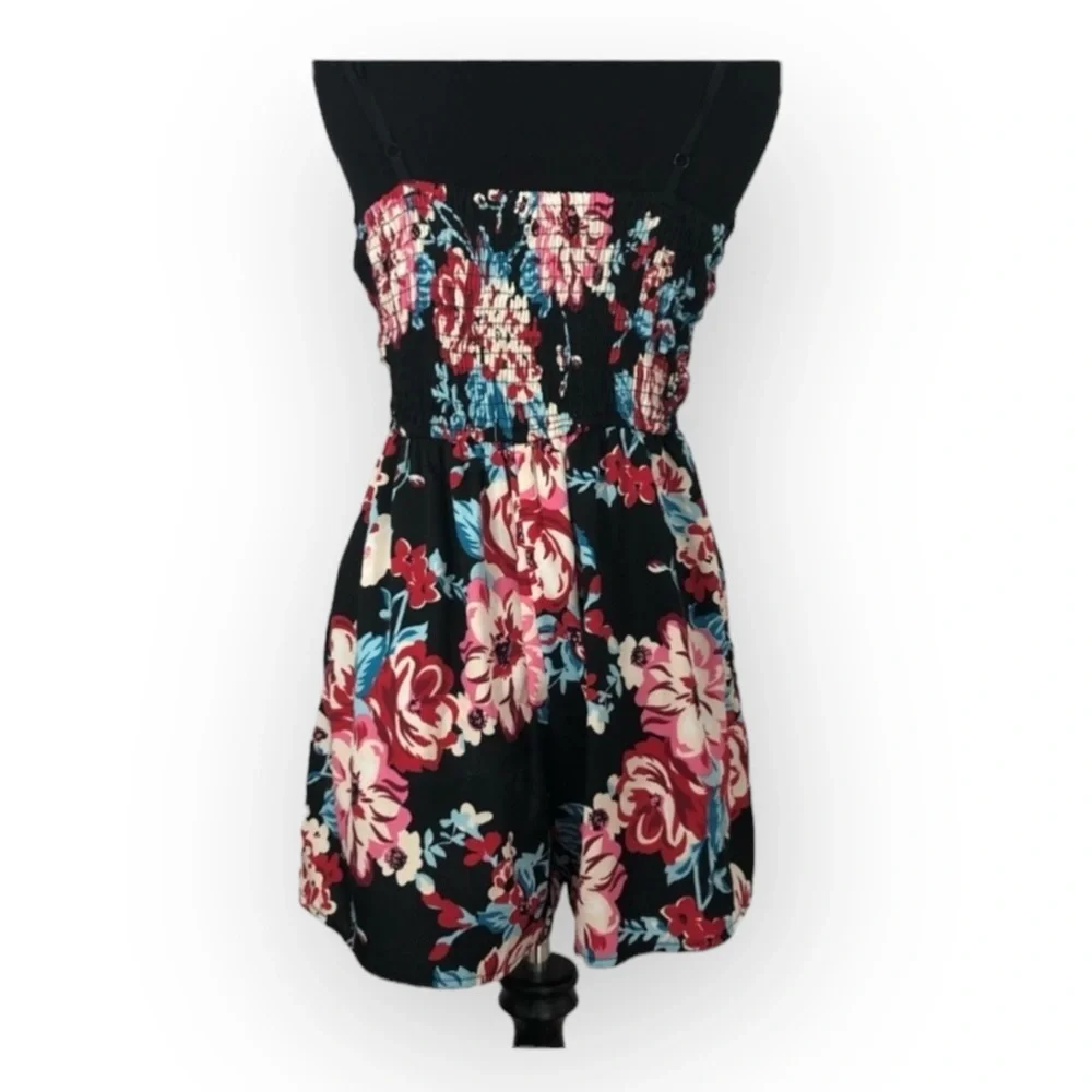 Band of Gypsies shorts romper black background with floral pattern